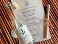 Anchor theme wedding invitation on a wooden surface