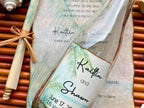 Wedding invitation with beach theme on a woven background
