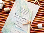 Wedding invitation with tropical design on a woven mat with shells and starfish