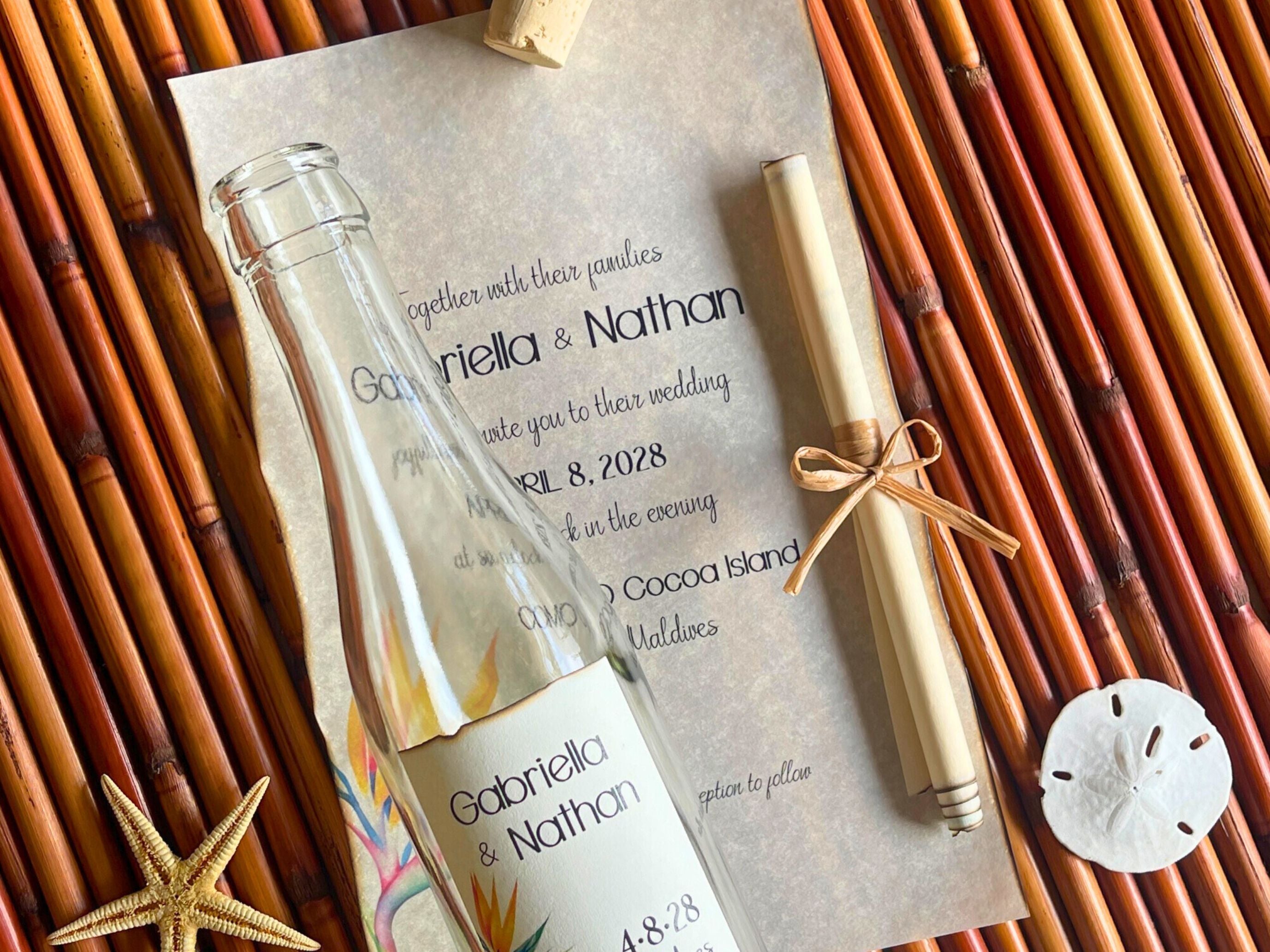 Wedding invitation with bottle and pen on woven mat