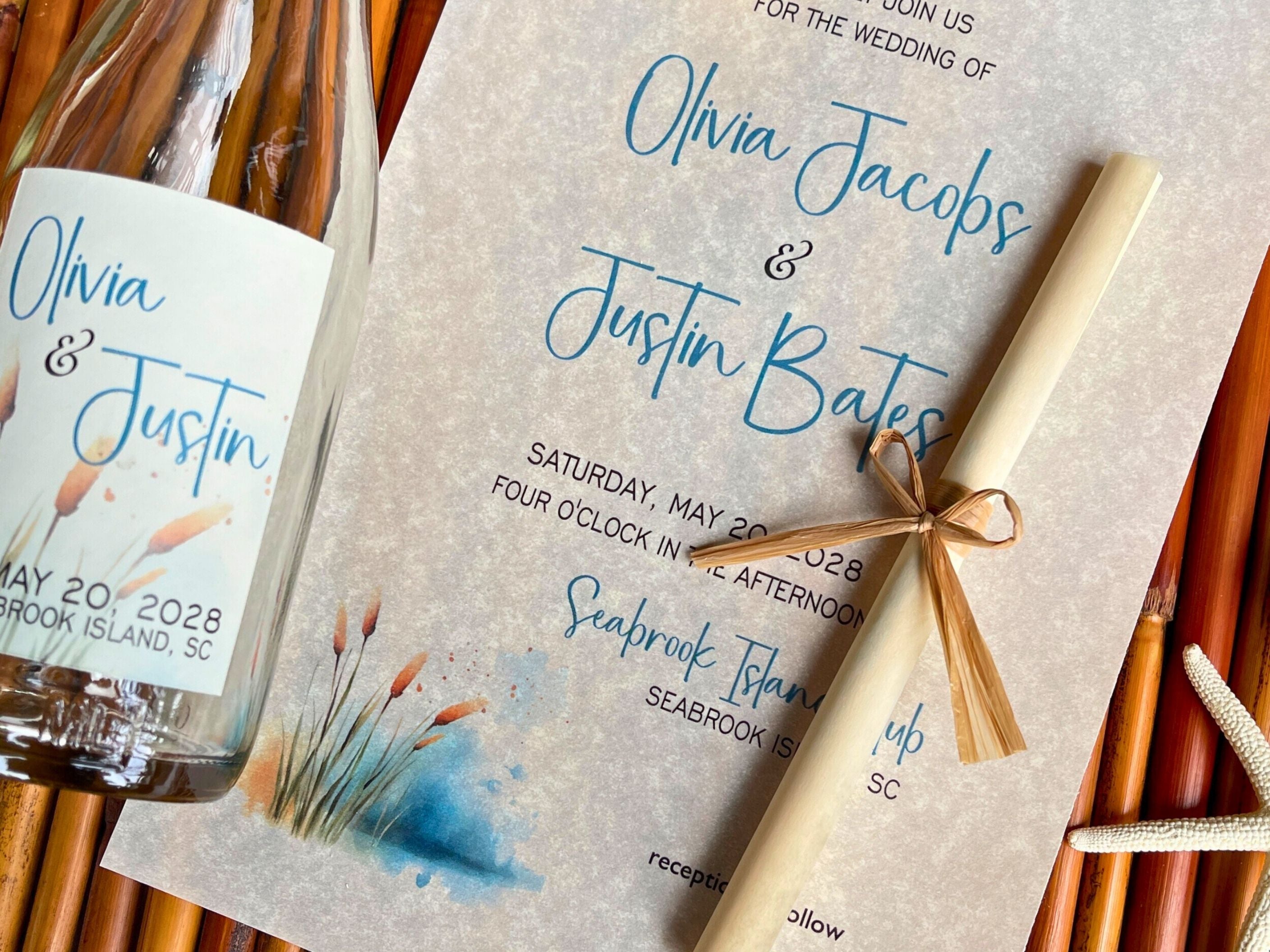Wedding invitation and glass bottle with a cattails theme