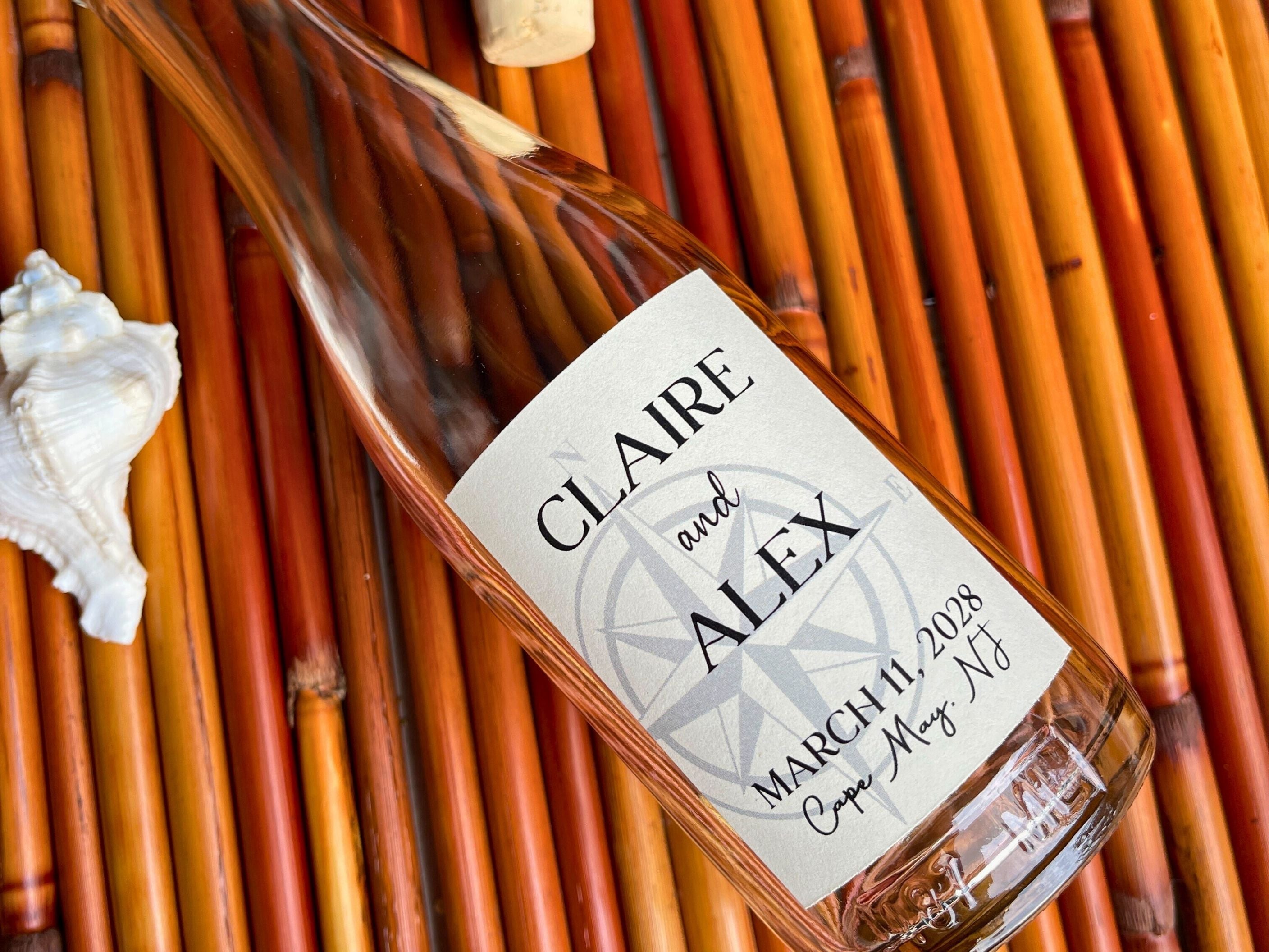 Glass bottle with a personalized label on a woven surface