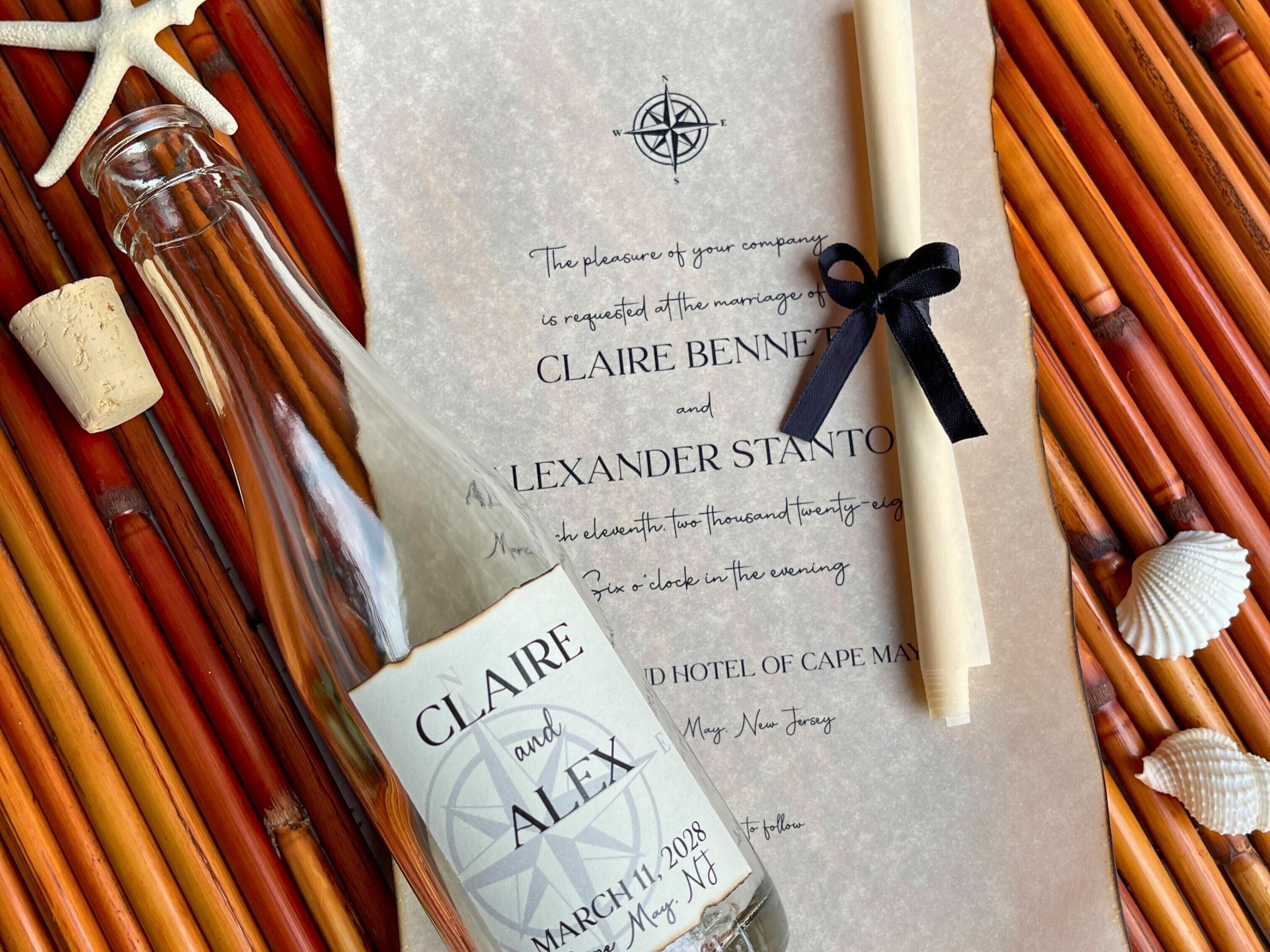 Wedding invitation with bottle and decorative elements on a textured surface