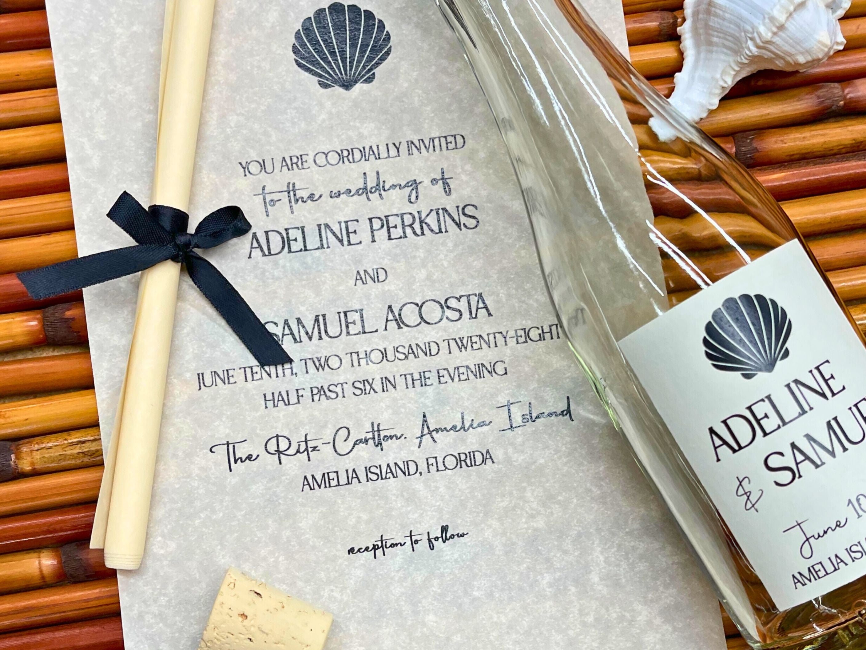 Wedding invitation with an elegant seashell design featuring black details for a beach wedding at The Ritz-Carlton, Amelia Island 