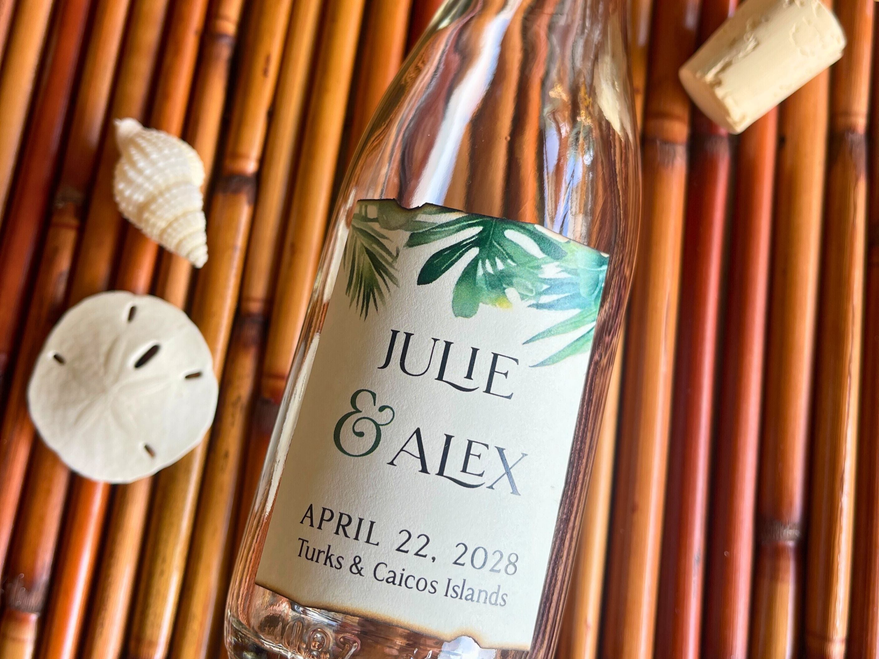Personalized bottle with a label for an event in Turks & Caicos Islands on a woven background