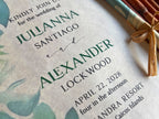 Wedding invitation card with green text on a textured background