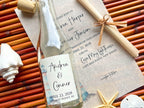 Personalized bottle with a label and scroll on a wooden surface with beach-themed decor.