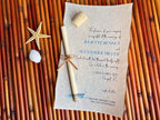 Wedding invitation with a vellum scroll and cork on a bamboo surface