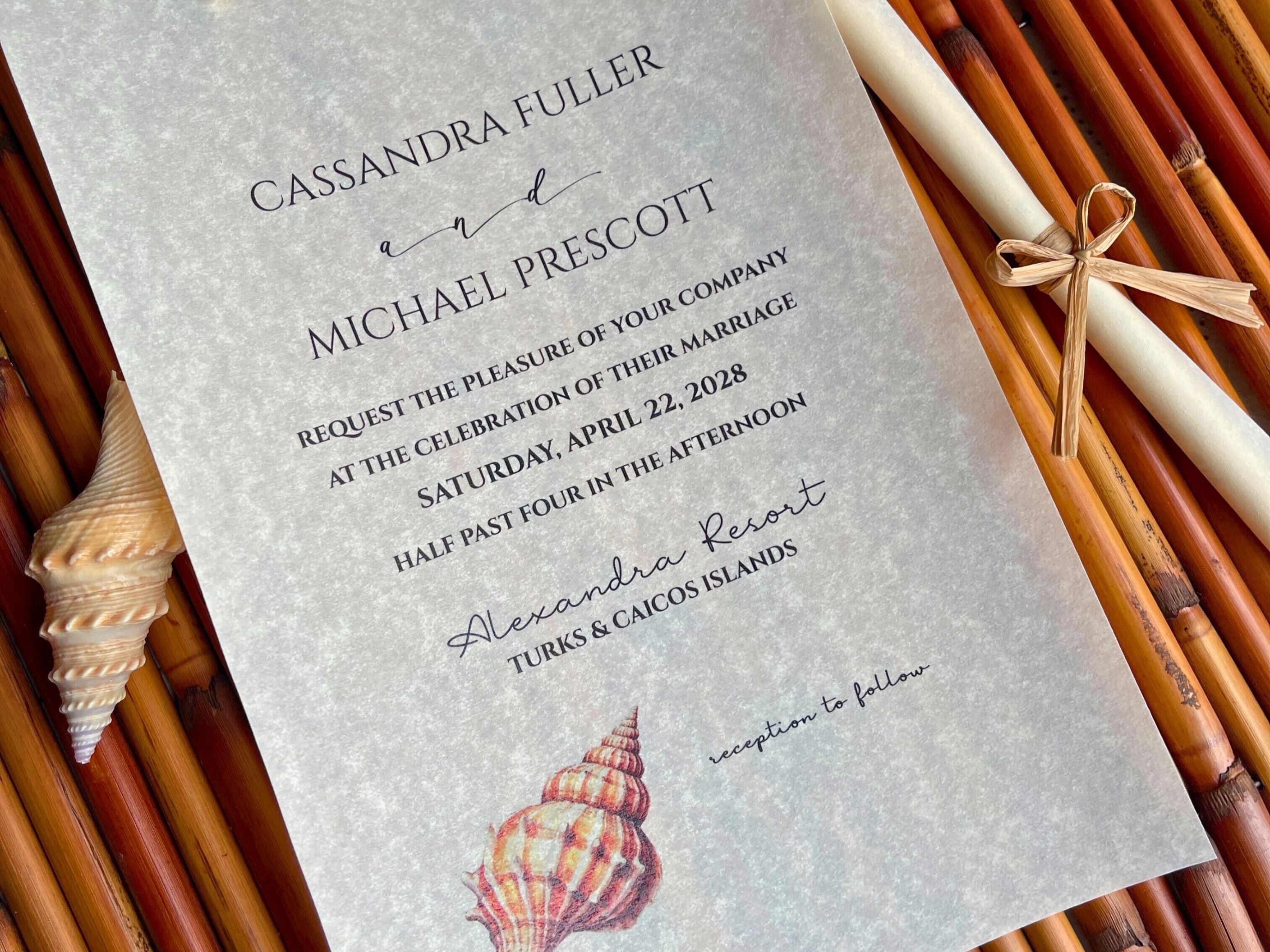 Wedding invitation with seashell design on a textured background