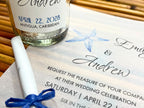 Wedding invitation with a bottle on a wooden surface