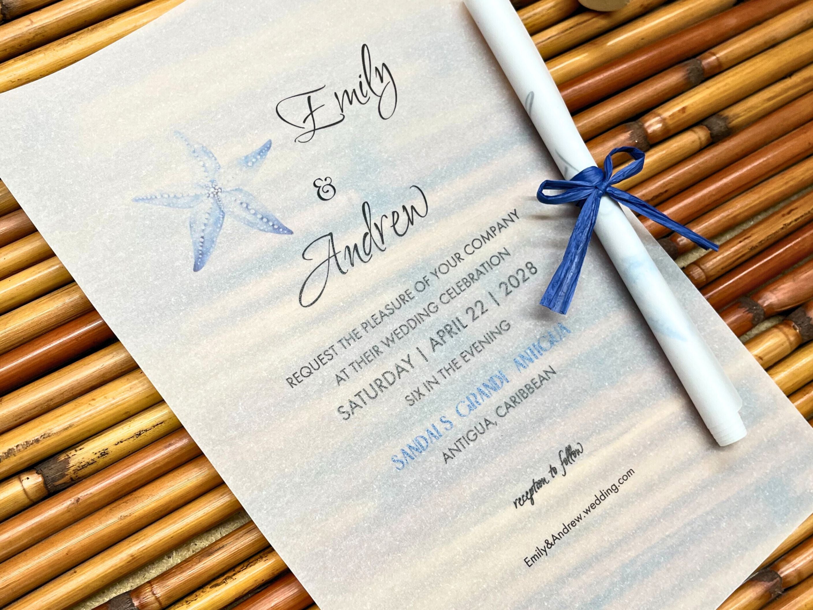 Wedding invitation with starfish design on a textured surface