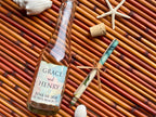 Bottle with a personalized label on a woven mat with decorative elements