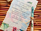 Wedding invitation with floral design on a bamboo mat