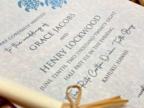 Wedding invitation with a blue turtle design  on a textured background