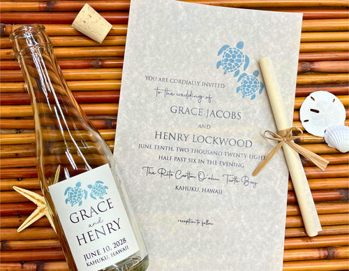 Glass bottle with turtle label and wedding invitation on a woven surface