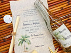 Wedding invitation with palm tree design for a beach wedding ceremony.