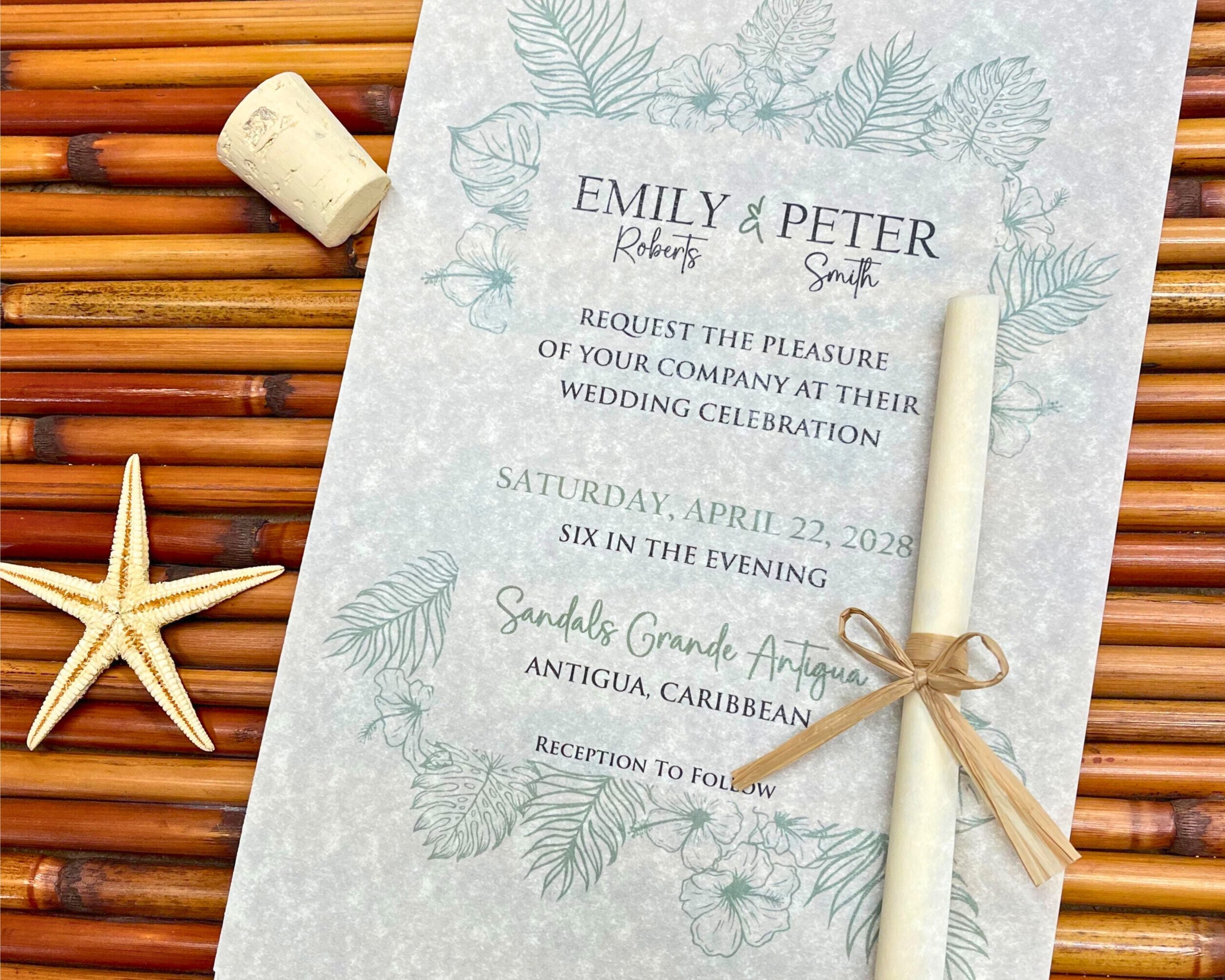 Wedding invitation with scroll on a textured surface with starfish and cork.